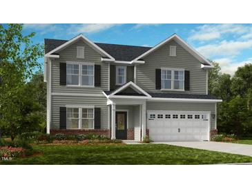 Two-story house with gray siding, brick accents, and a two-car garage at 664 Morning Glade St, Wake Forest, NC 27587