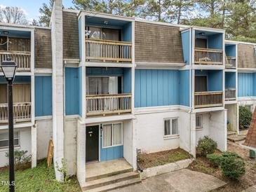Two-story building with light blue siding and balconies at 7002 Longstreet Dr # C, Raleigh, NC 27615