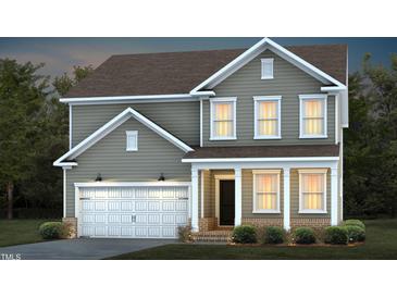 Two-story house with gray siding, white garage door, and landscaping at 769 Denburn Pl, Raleigh, NC 27603