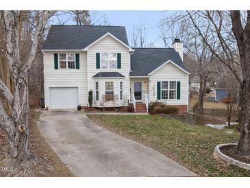 Two-story house with attached garage and landscaped yard at 1006 Silent Retreat Ln, Knightdale, NC 27545