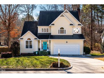 Beautiful two-story house with a charming front yard at 1001 Chimney Hill Dr, Apex, NC 27502