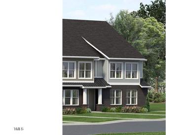 Charming two-story home features large windows, manicured landscaping, and inviting curb appeal at 3025 White Rail Dr, Fuquay Varina, NC 27526