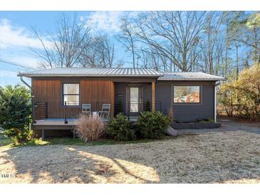 Modern craftsman home with gray siding, wood accents, and deck at 2404 Boswell Rd, Raleigh, NC 27610