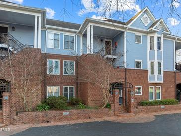 Brick building with blue accents, multiple units, and a charming facade at 243 New Bern Pl # 301, Raleigh, NC 27601