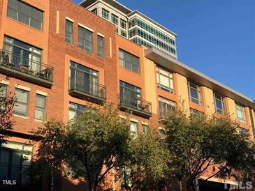 Brick building exterior with balconies and city views at 444 S Blount St # 316, Raleigh, NC 27601