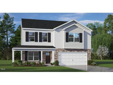 Two-story house with white siding, dark roof, and a two-car garage at 1204 Perseus Hill Ct, Wendell, NC 27591