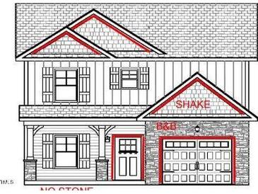 Two-story house with stone accents, shake siding, and a two-car garage at 4166 Darroch Rd, Lillington, NC 27546