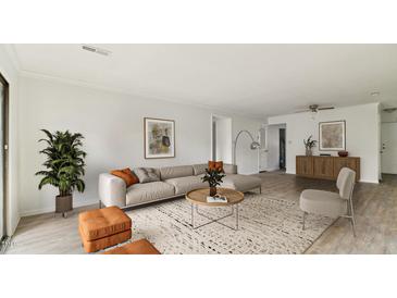 Bright living room with comfy seating and large windows at 550 Pine Ridge Pl, Raleigh, NC 27609