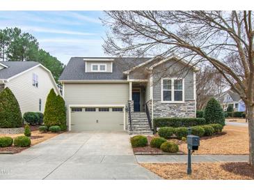 House exterior featuring stone accents and a two-car garage at 1400 Basley St, Wake Forest, NC 27587