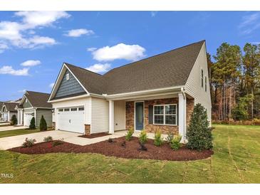 Newly constructed home with stone accents and a 2-car garage at 201 Brickwell Way, Youngsville, NC 27596