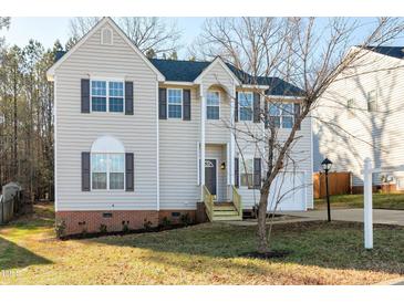 Charming two-story home with neutral siding, black shutters, and an attached two-car garage at 2901 Alder Ridge Ln, Raleigh, NC 27603