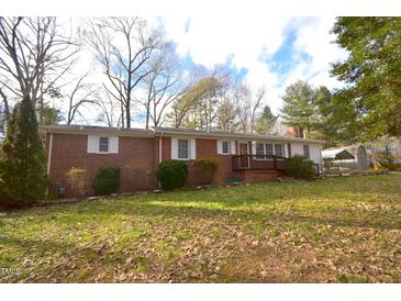 Brick ranch home with a spacious yard and mature trees at 315 Lakeshore Dr, Hillsborough, NC 27278