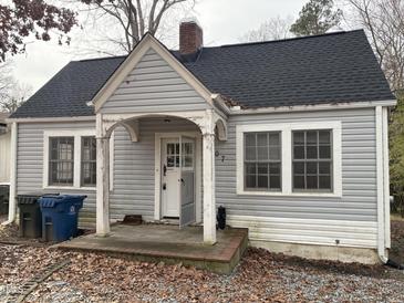 Gray house with a front porch and small yard at 2607 Vineyard St, Durham, NC 27707