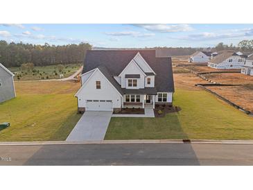 New construction two story home with a 2-car garage and beautifully landscaped yard at 66 Tennyson Dr, Garner, NC 27529