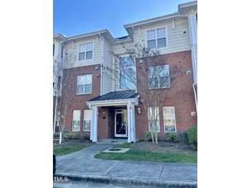 Brick building exterior with landscaping and entrance at 814 Providence Glen Dr, Chapel Hill, NC 27514