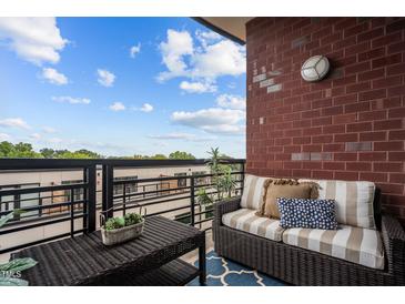 Relaxing balcony with wicker furniture, offering a peaceful outdoor space at 618 N Boylan Ave # 826, Raleigh, NC 27603