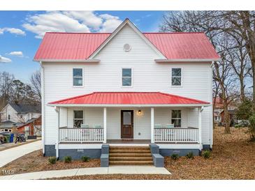 Two-story home with red roof, white siding, and front porch at 211 Long Ave, Graham, NC 27253