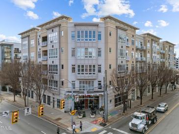 Exterior view of The Dawson building, a modern multi-story residential building at 317 W Morgan Street # 405, Raleigh, NC 27601