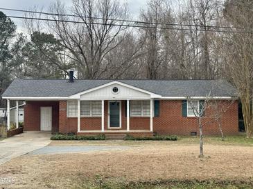 Brick ranch house with attached garage and carport at 3395 Nc Hwy 210, Smithfield, NC 27577