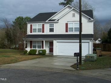 Charming two-story home with white siding, red shutters, and a spacious two-car garage at 4809 Kaycee Ct, Raleigh, NC 27616
