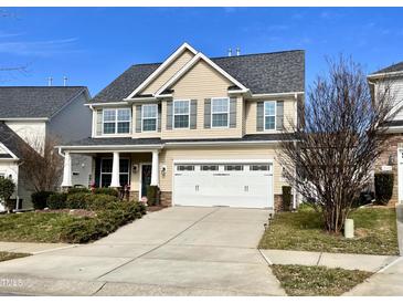 Two-story house with a neutral color scheme and a landscaped front yard at 1936 Sinclair Trce, Burlington, NC 27215