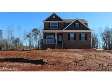 Two-story brick home with front porch and attached garage at 1410 Reading Ct # 92Kl, Burlington, NC 27217