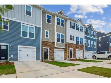 Modern townhouses with attached garages and landscaped yards at 807 Parc Townes Dr # 27, Wendell, NC 27591