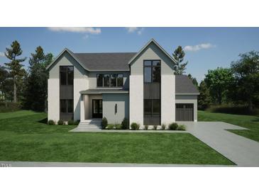 Stunning two-story home with modern design, beautiful landscaping, and a well-manicured lawn at 3813 Peaceful Creek Trl, Zebulon, NC 27597