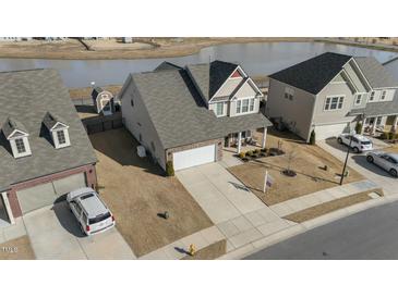Two-story house with a spacious yard and lake view in a quiet neighborhood at 2120 Blue Iris Way, Zebulon, NC 27597