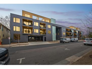Modern apartment building featuring a secure parking garage and inviting balcony spaces at 29 Enterprise St # 107, Raleigh, NC 27607