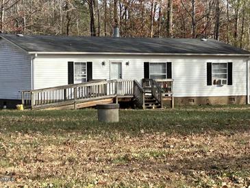 Single-story home with ramp access and wooden steps at 316 Acorn Ct, Rougemont, NC 27572