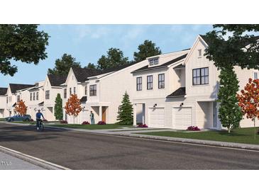Row of charming new townhouses with attached garages and modern farmhouse design at 937 Selby Ave, Durham, NC 27713