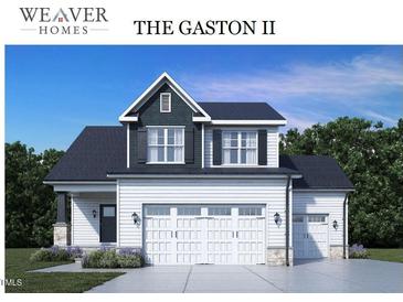 Two-story home with a white exterior, dark roof, and a three-car garage at 117 Boyce Ct, Sanford, NC 27332