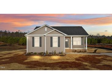 Charming single-story home with a cozy front porch and beautiful sunset sky at 150 Brookhaven Dr, Spring Hope, NC 27882
