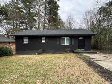 Newly renovated black brick ranch home with a spacious yard at 905 Corona St, Durham, NC 27707