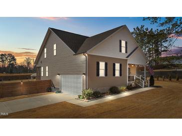 Two-story house with a gray and beige exterior, landscaped lawn, and a wooden fence at 1424 Old Watkins Rd, Raleigh, NC 27616