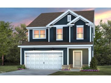 Two-story house with a white garage door and dark blue siding at 2908 Huxley Way, Apex, NC 27502