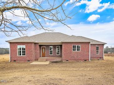 Brick ranch house with a covered porch and a large yard at 330 Ellis Stewart Ln Ln, Cameron, NC 28326