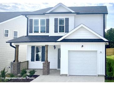 Two-story house featuring a white exterior, gray shutters, and a two-car garage at 346 Maidenhair Pl, Clayton, NC 27520