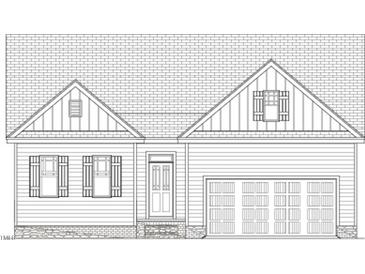 Charming single-story home featuring a symmetrical facade, attached garage, and classic shuttered windows at 45 Mossman Ct, Zebulon, NC 27597