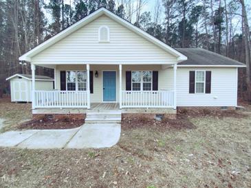 Charming one-story house with a front porch and storage shed at 610 Lockwood Dr, Clayton, NC 27527