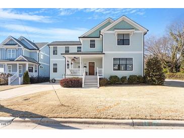 Two-story craftsman style home with front porch and landscaping at 700 Coleman St, Raleigh, NC 27610