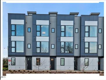 Modern three-story townhouses with gray siding and large windows at 712 E Edenton St # 105, Raleigh, NC 27601