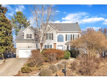 Two-story house with gray roof, attached garage, and landscaping at 101 Pebble Springs Rd, Chapel Hill, NC 27514