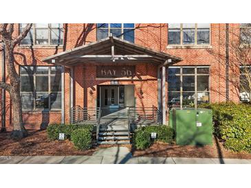 Brick building exterior with covered entryway and stairs at 500 N Duke St # 56-207, Durham, NC 27701