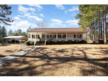 Charming one-story home featuring a welcoming front porch and well-maintained landscaping at 5141 Nc-39 N Hwy, Henderson, NC 27537