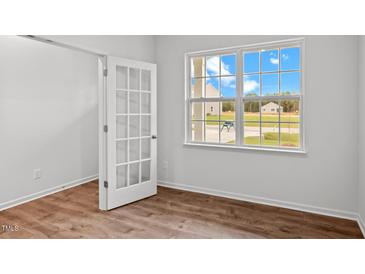 Bright home office features wood-look floors and a view of the backyard at 7611 Michelle Rd, Rocky Mount, NC 27803