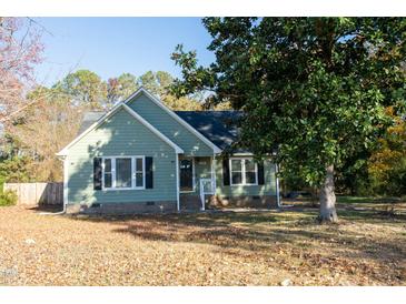 Green house with black shutters and landscaping at 248 Southgate Dr, Garner, NC 27529