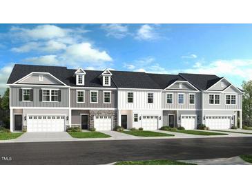 New townhome community with 4 units, 2-car garages, and attractive exterior finishes at 265 Sweetbay Tree Dr, Wendell, NC 27591
