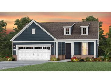 Charming craftsman style home with a two-car garage and landscaped yard at 334 Arcadius Dr, Clayton, NC 27520